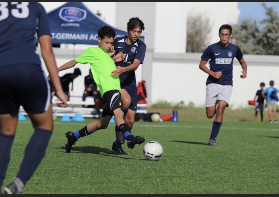 Wolves player striking the ball past a defender